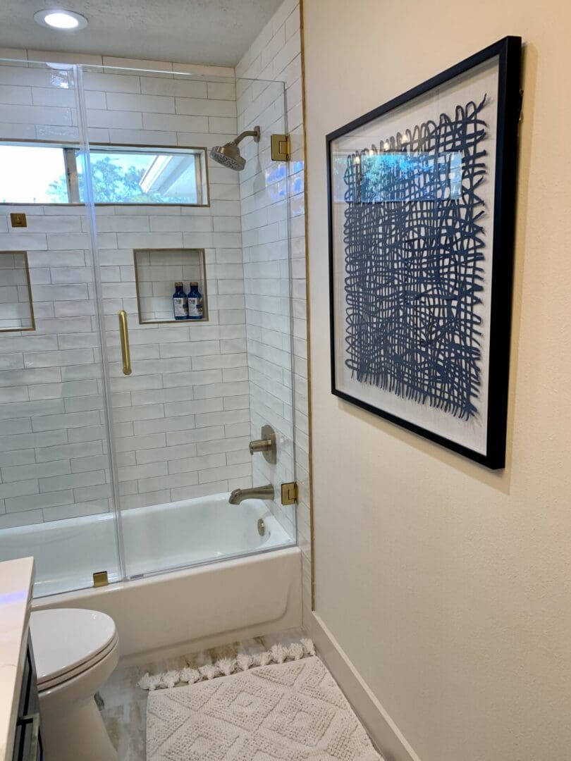 A white bathroom with a bathtub and shower.