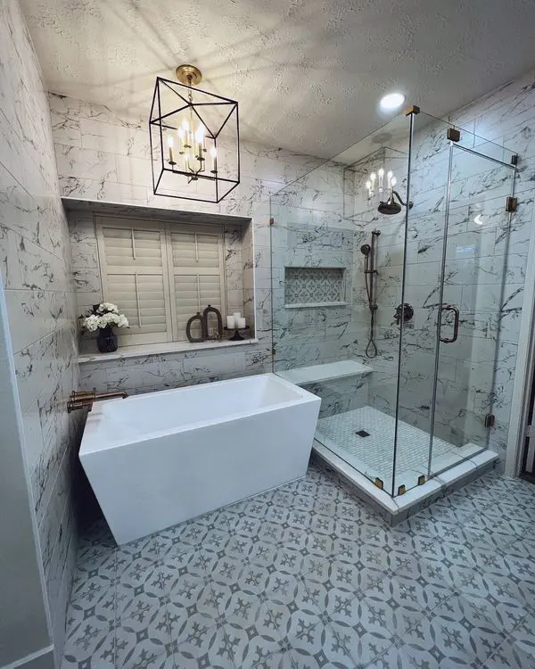 A bathroom with a glass shower and tub.